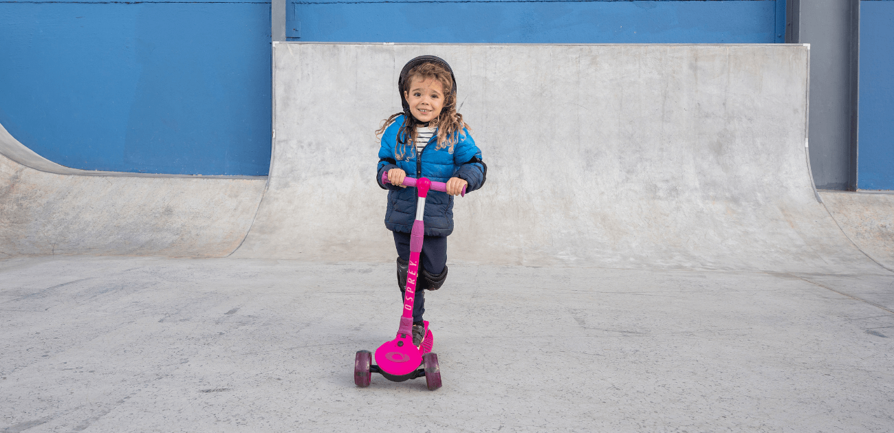 Child riding a scooter outdoors, capturing the joy and freedom of scootering for kids.