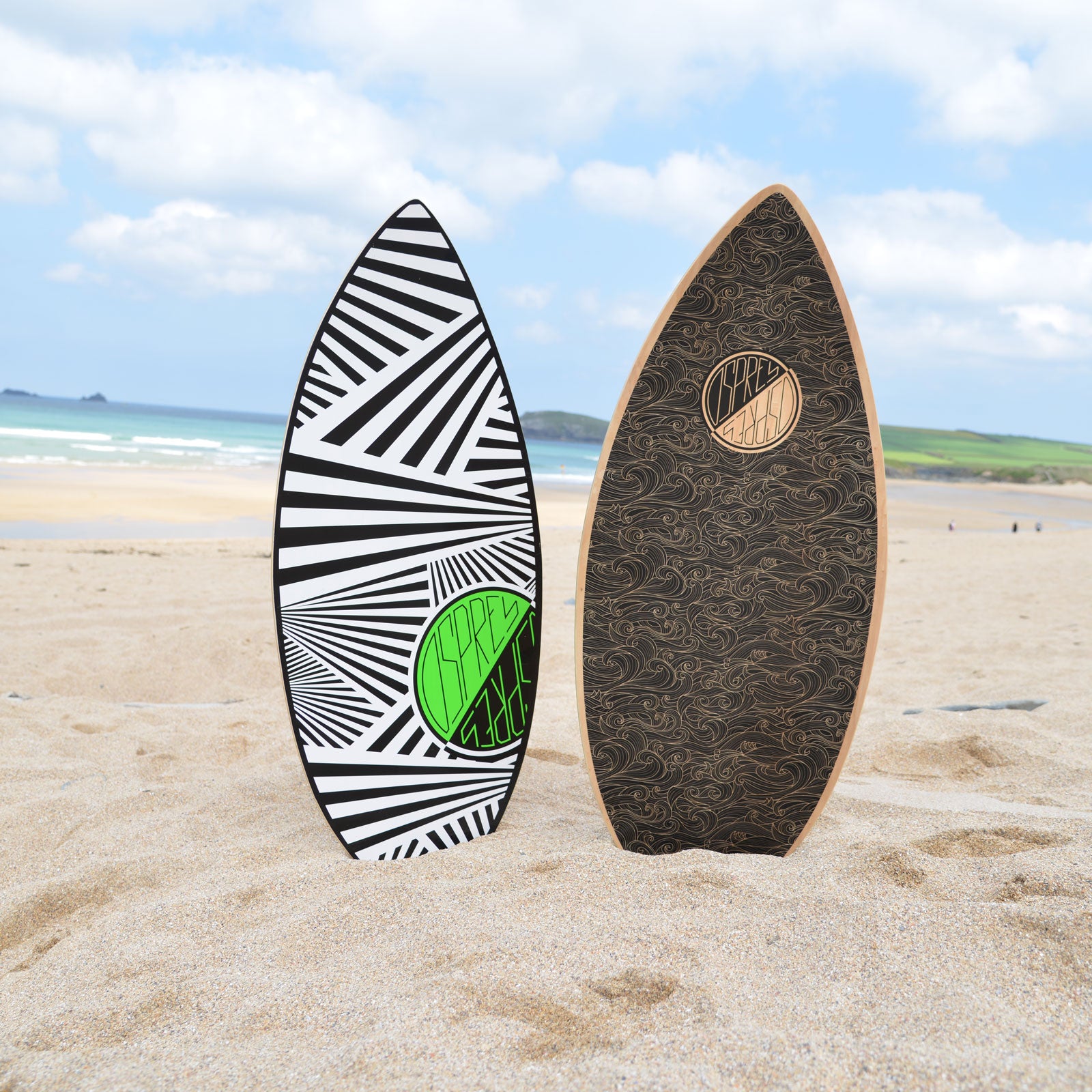 osprey skimboards in sand side by side with bold, unique designs